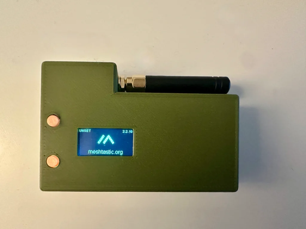 a green rectangular device with a blue screen and a blue screen